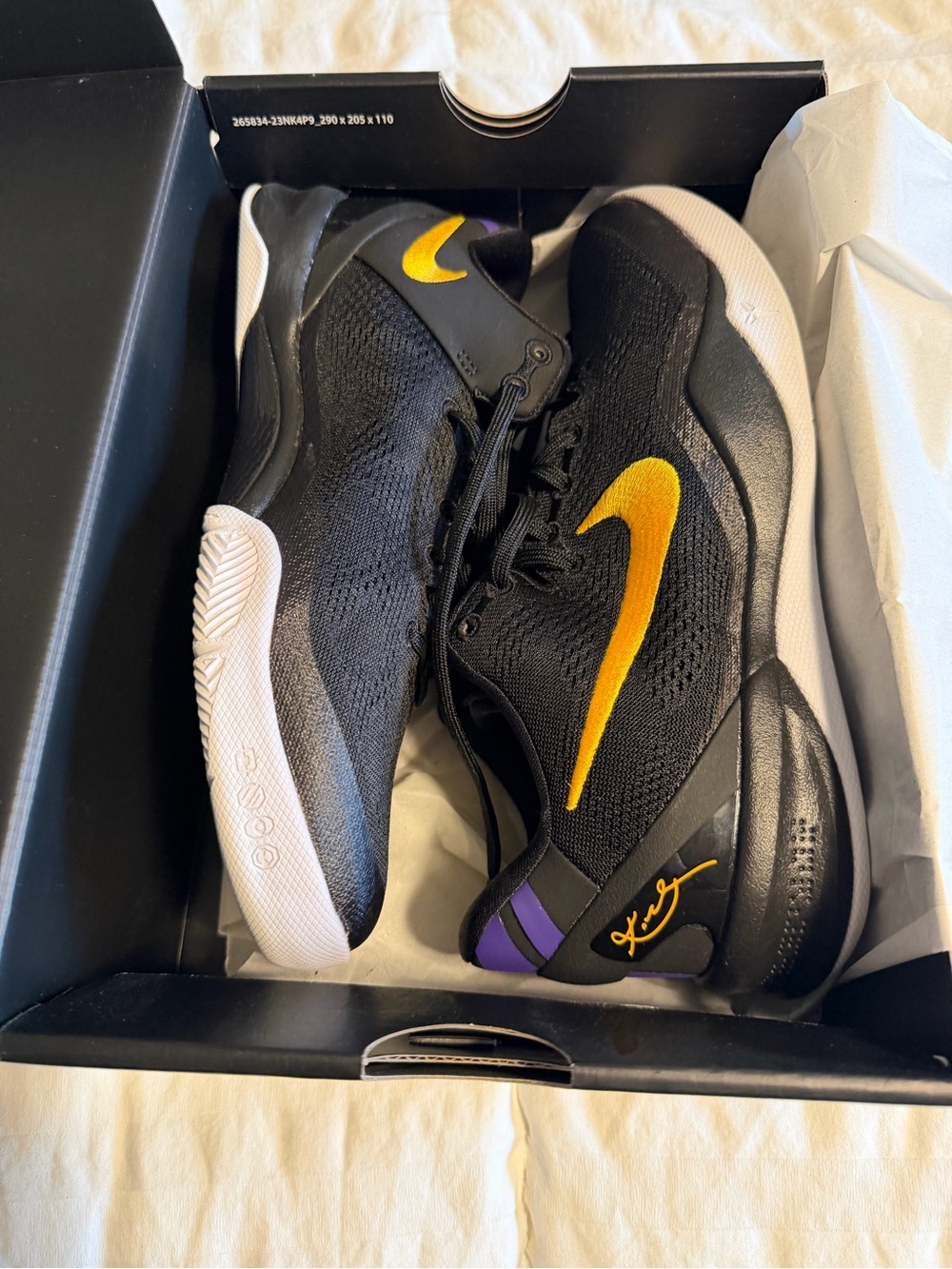 Nike boys Black Sneakers with Gold Swoosh and Purple Accents